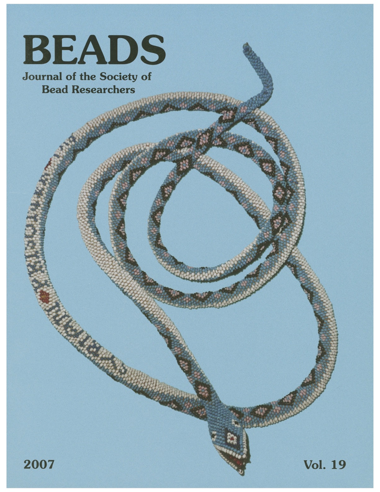 Volume 19 cover, featuring a long beaded snake.